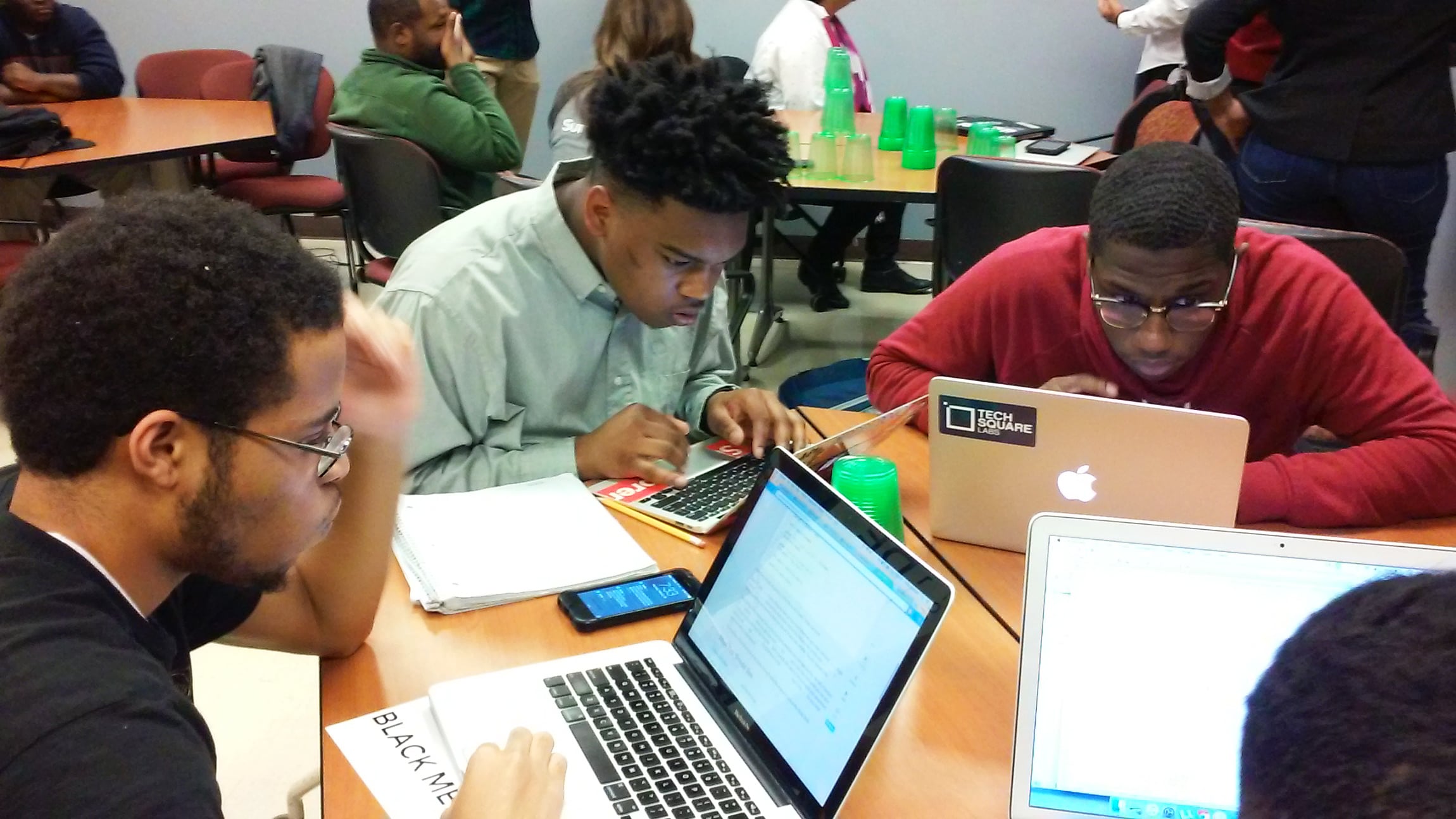 Students collaborating in a tech hub